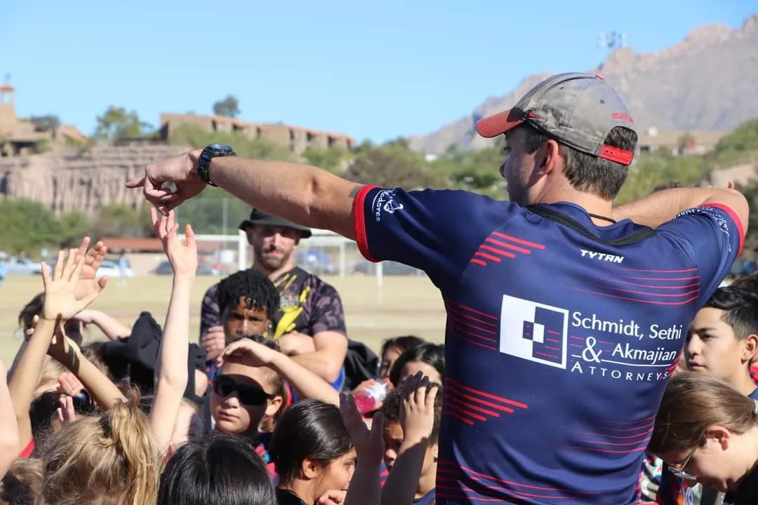 Camden McGregor coaching young rugby players with the Engage Foundation